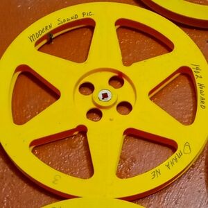 Vintage Yellow Film Reel Wall Decor has the name Howard could it be ron Howard ?